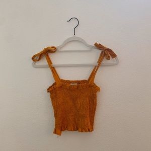mustard colored tank with straps